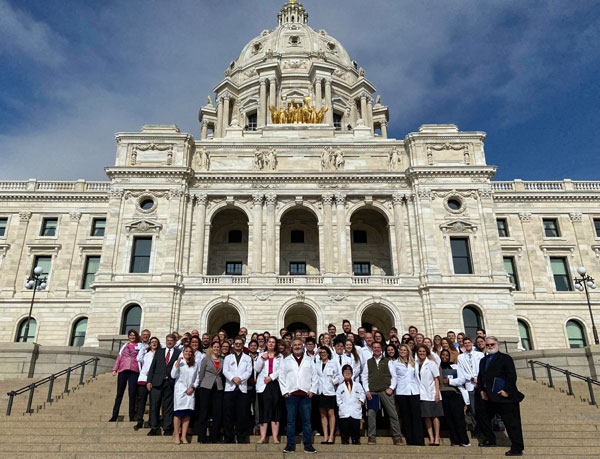 Group of pharmacy advocates standing outside the MN state capital building