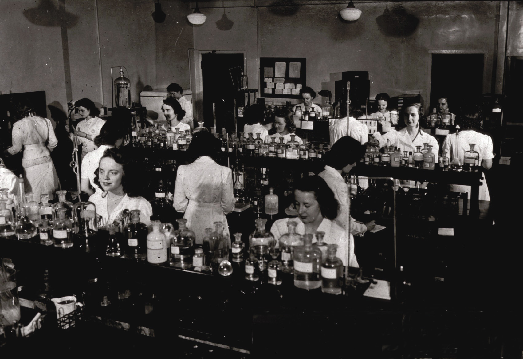 People working in a MLS lab in 1930s