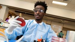 MLS Student Abdi Farah working in a lab