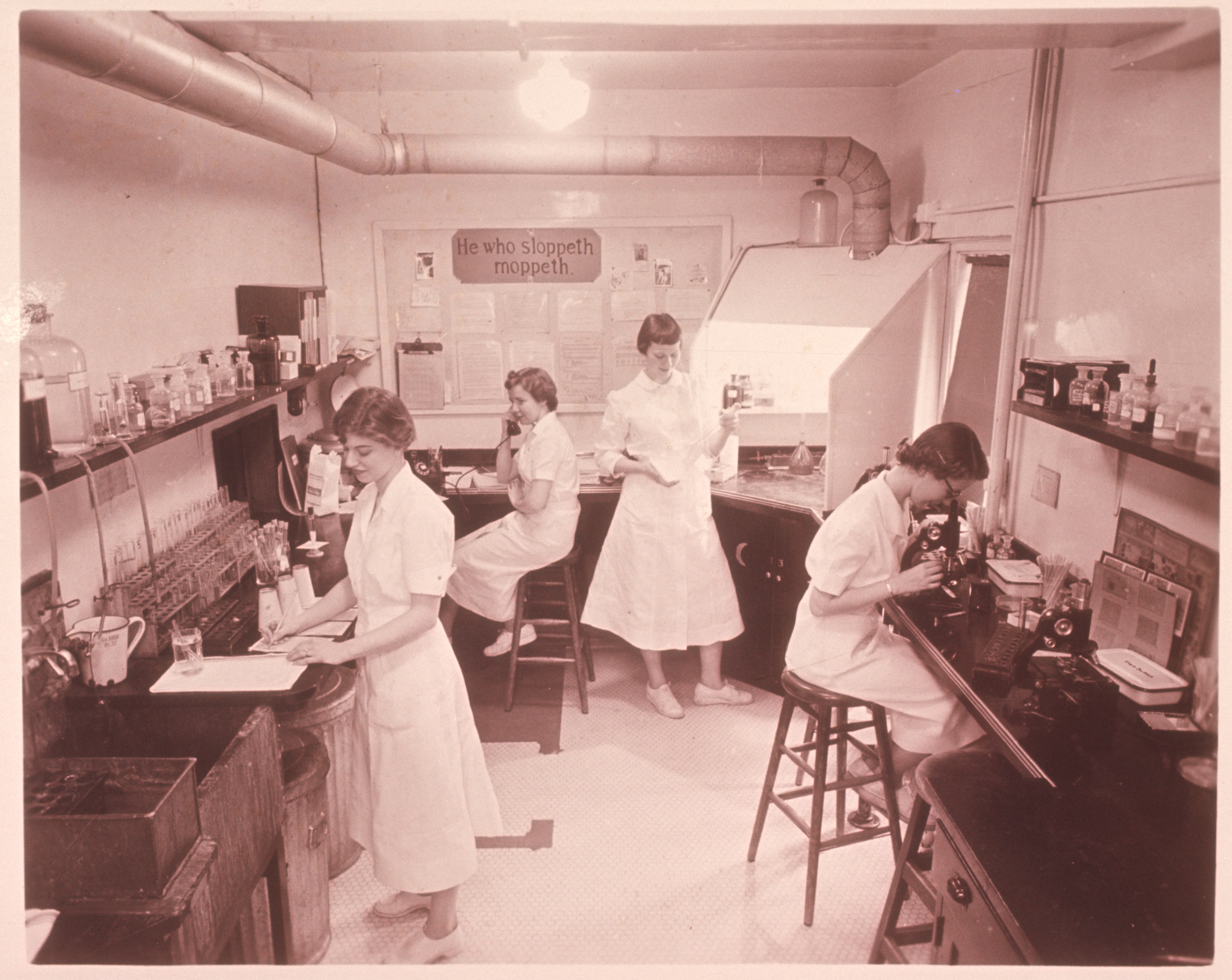 Group of people working in a MLS lab 100 years ago