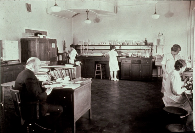 People working in a MLS lab in 1920s