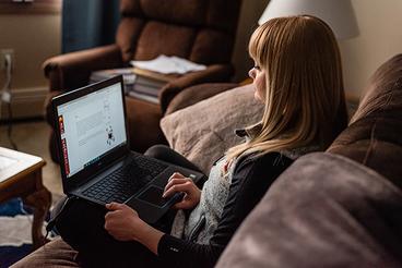 Andrea Gredvig working in a laptop