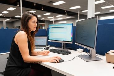 Galina Dronova looking at a desktop