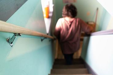 Michelle Hutchens climbing down the stairs