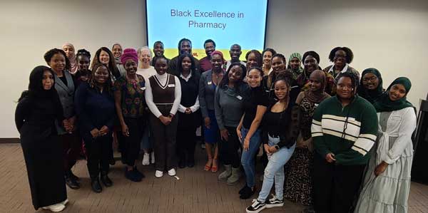 Concordant mentoring group smiling in classroom