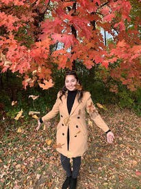 Karen Herrera under a tree in fall